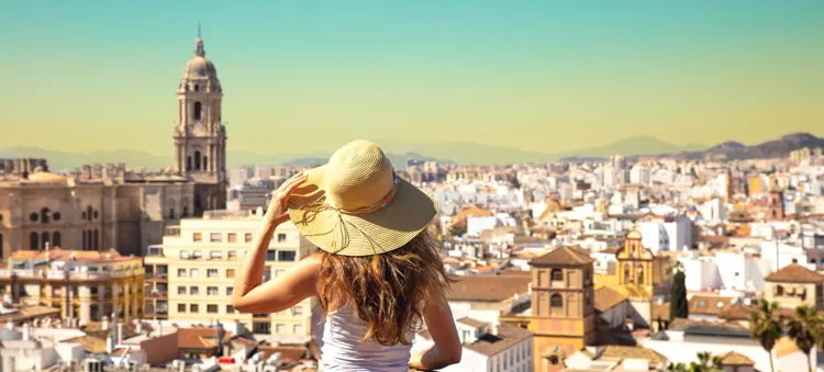 An expat woman looking at the skyline in Malaga