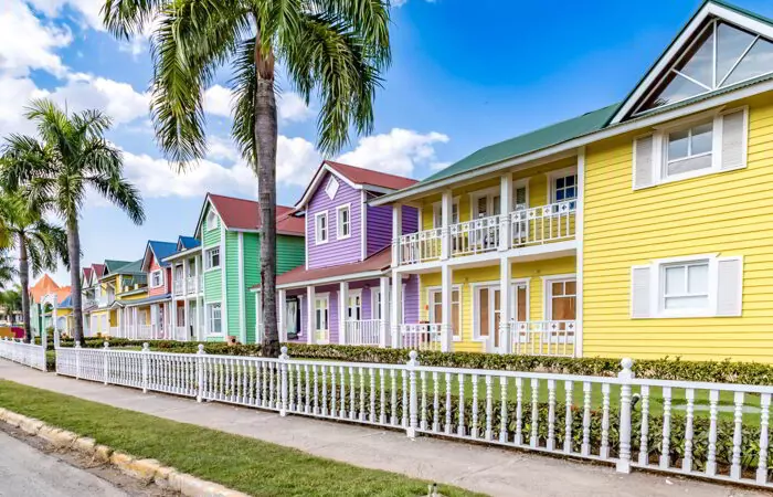 Typical dominican colorful wood houses, palm trees on an emblematic downtown street, Samana, Dominican Republic