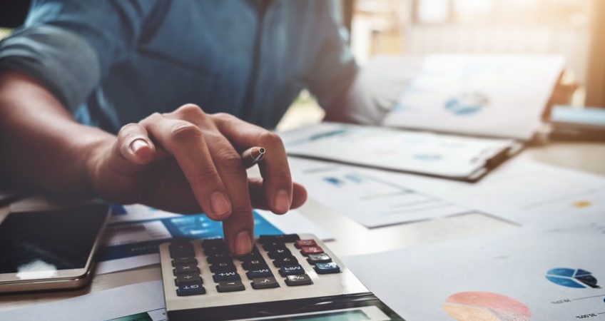Man working out investment returns