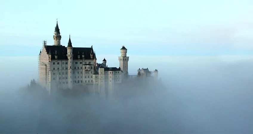 A castle that appears to be floating in the clouds