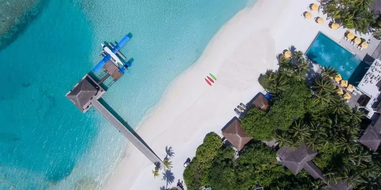 A turquoise water and white sand beach