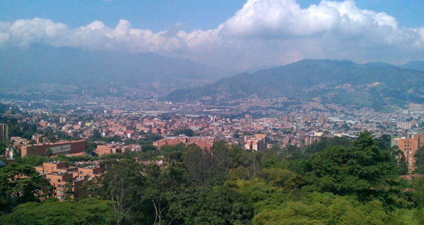 View out across the city of Medellin, Colombia. Mountains visable in background and lots of greenery
