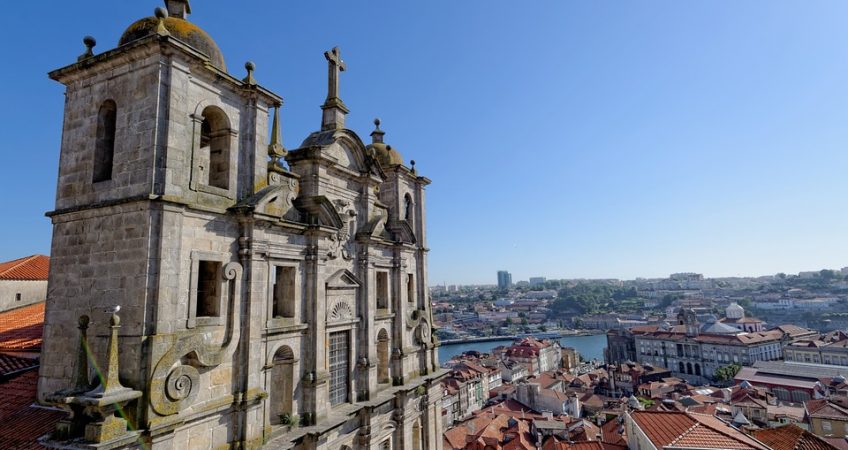 Old colonial building in porto portugal. View across the red topped houses of the city and out to the river