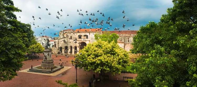 Doves flying over main square, Santo Domingo, Dominican Republic