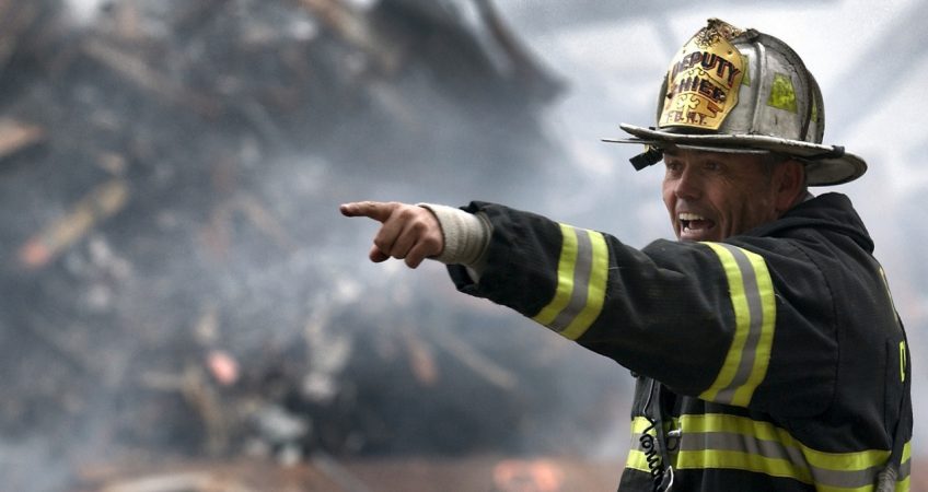 A firefighter pointing a location