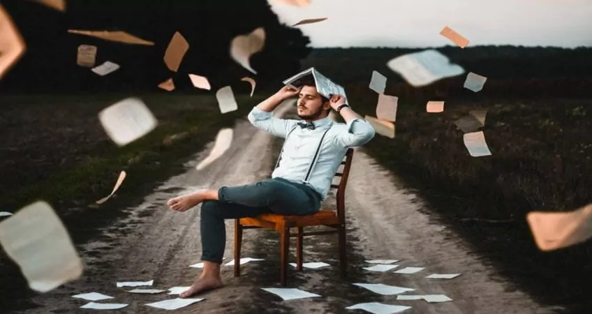 Man in chair, doing taxes