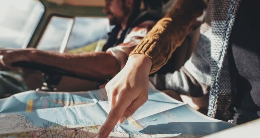 Couple Looking At A Map Road Trip