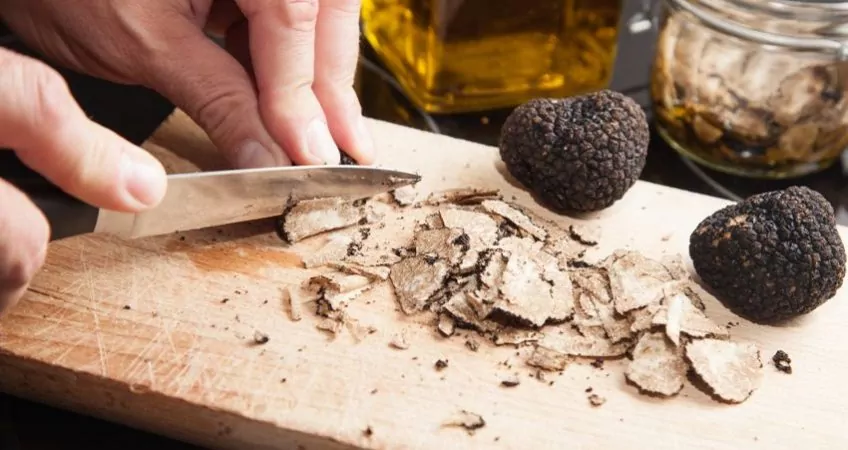 french black truffles on a chopping board