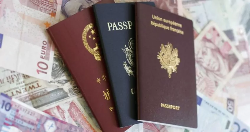 French, U.S. and Chinese passport on money