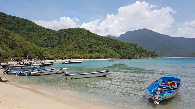 A beach with boats in Santa Marta, Colombia