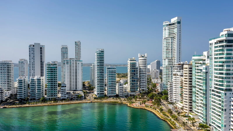 Aerial view of a skyline of white residential skyscrapers in Cartagena's prestigious Castillogrande district.