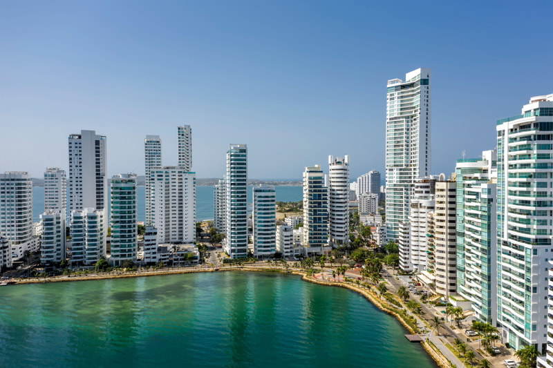 Aerial view of a skyline of white residential skyscrapers in Cartagena's prestigious Castillogrande district.