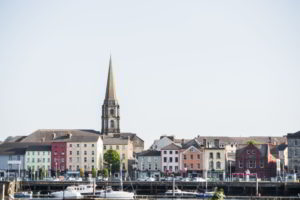 Church steeple above colorful irish village of Waterford, Ireland