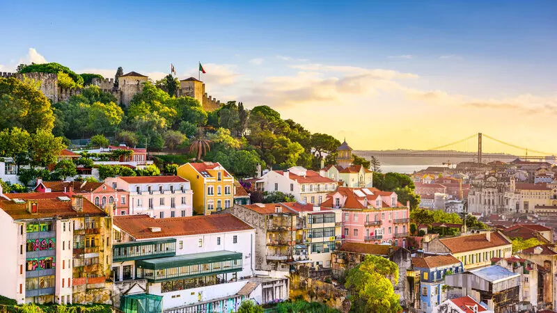 Lisbon, Portugal old town cityscape at dusk.