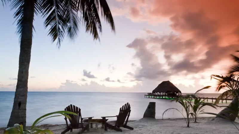 Beautiful tranquil beach sunrise in Southern Belize.