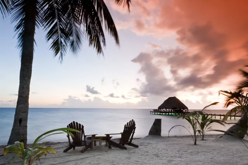Beautiful tranquil beach sunrise in Southern Belize.