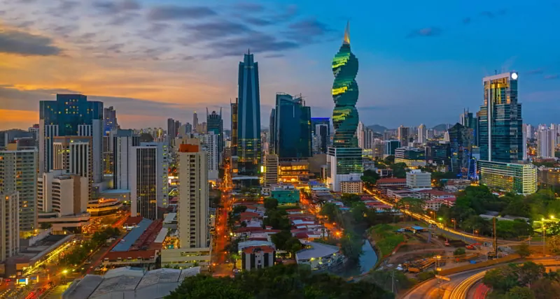 Colorful panorama of the skyline of Panama City at sunset with high rise skyscrapers, Panama.