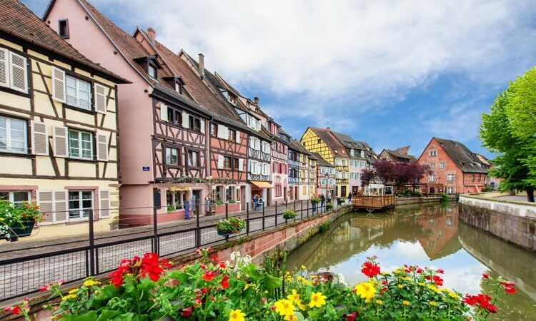 Colorful traditional French houses on the side of river Lauch in Petite Venise, Colmar, France.