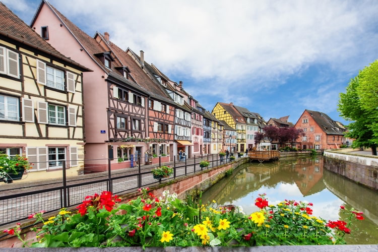 Colorful traditional French houses on the side of river Lauch in Petite Venise, Colmar, France.