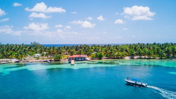 Aerial Drone view of South Water Caye tropical island in Belize barrier reef.