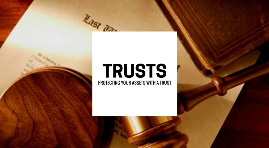 Trusts Paperwork for a trust and last will and testament on a desk.