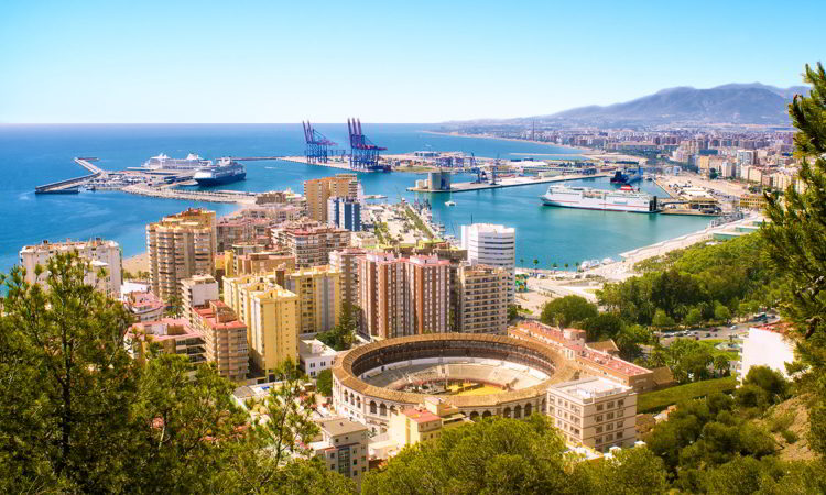 View of Malaga with bullring and harbor