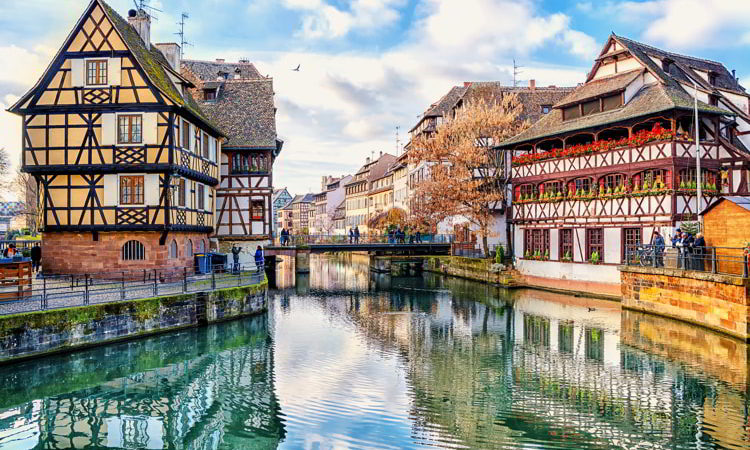 Traditional half-timbered houses on a canal in France