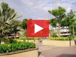 A park in David Panama, with a red play button