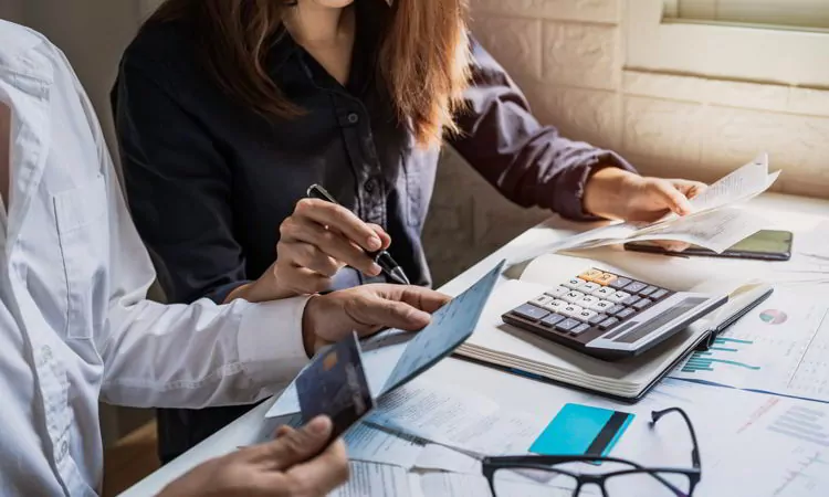 Couple checking bills