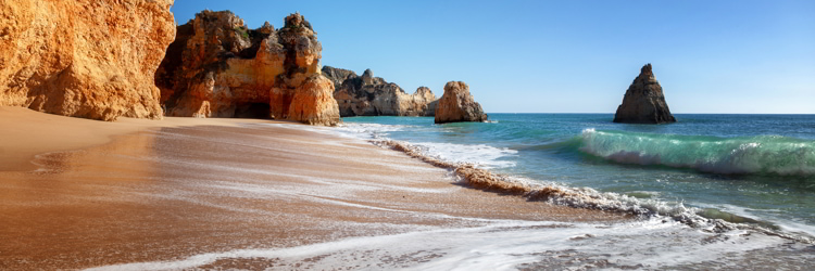 A panoramic view of a white sandy beach in Algarve, Portugal
