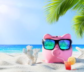Piggy Bank With Drink On The Palm Beach