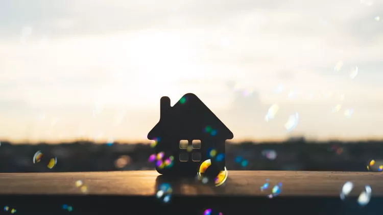 House model on black table with many bubble and black background