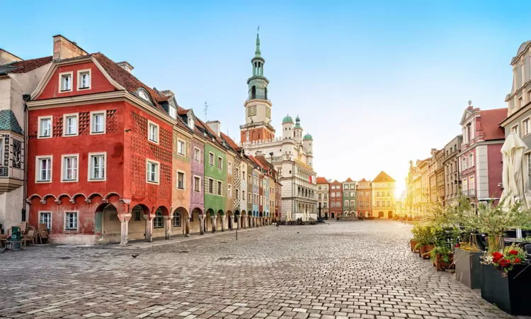 Stary Rynek square with small colorful houses and old Town Hall in Poznan, Poland