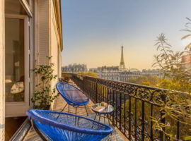 Beautiful Paris balcony at sunset with Eiffel Tower view