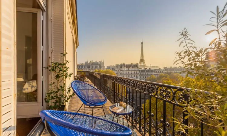 Beautiful Paris balcony at sunset with Eiffel Tower view