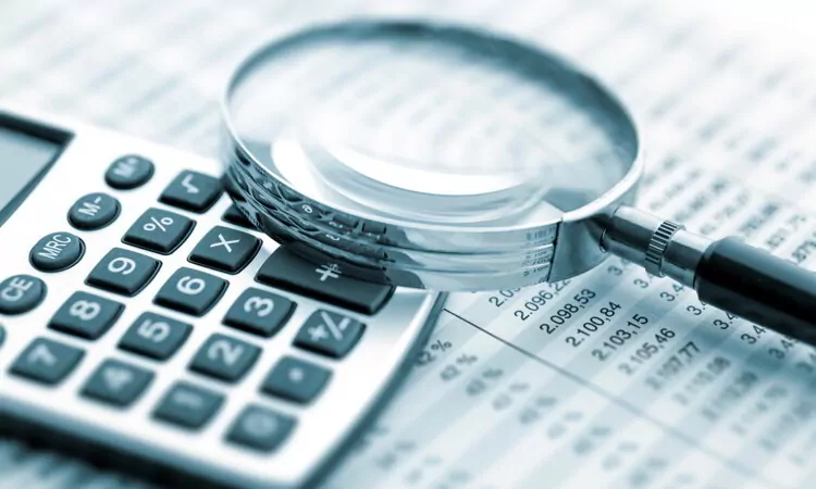 Magnifying glass on financial graph