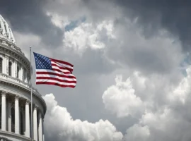 US Capitol and American waving flag