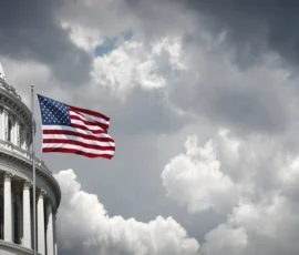 US Capitol and American waving flag