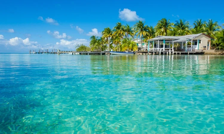 Belize Cayes - Small tropical island at Barrier Reef with paradise beach
