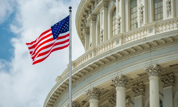 Washington DC Capitol dome detail with waving american flag