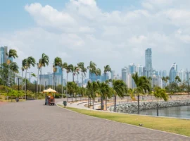 Sidewalk at public park with city skyline at coast promenade in Panama City Panama