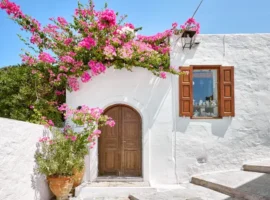 Facade of traditional white house in Lindos town at Rhodes island