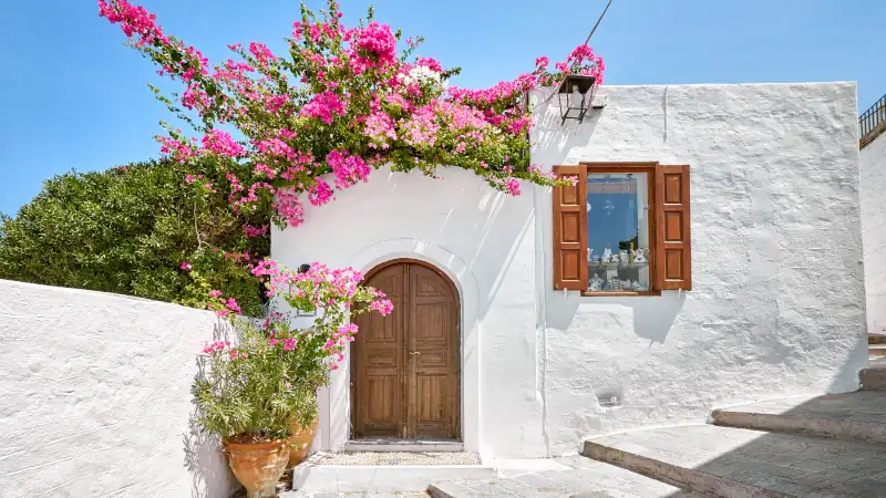 Facade of traditional white house in Lindos town at Rhodes island