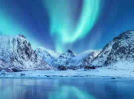Aurora borealis on the Lofoten islands, Norway. Green northern lights above mountains.